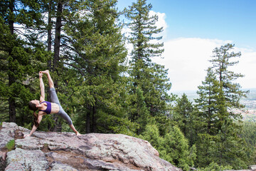 Strong and flexible woman practices yoga