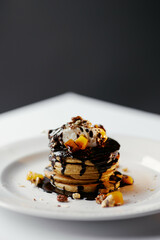 pumpkin pancakes poured with chocolate