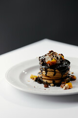 pumpkin pancakes poured with chocolate
