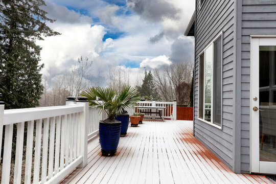 Early Winter Or Late Autumn Snow Fall Blanketing Home Outdoor Patio