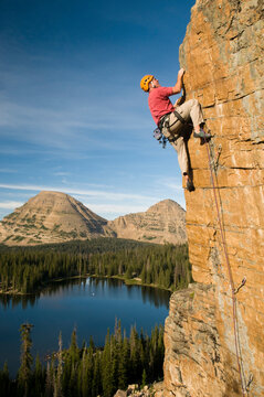 A man rock climbing above Scout Lake, Uinta Mountains, Francis, Utah.
