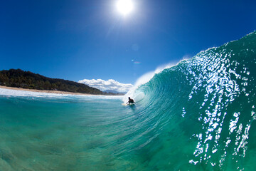 A water view of a surfer getting barreled at Pupukea Sandbar.