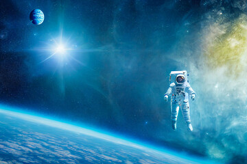 An American astronaut is floating in space while wearing a spacesuit.