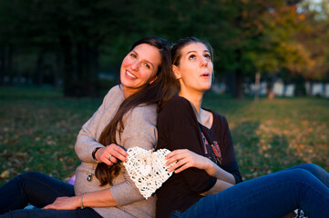 couple sitting on bench in park