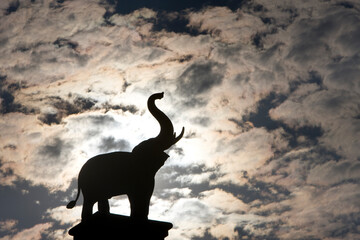 The silhouette of an elephant back lit against the setting sun is seen during a visit to Chiang Mai Zoo's famed