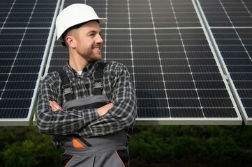 Solar power plant worker checks the condition of the panels