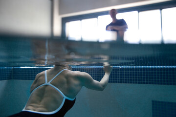 Female swimmer trains in a pool