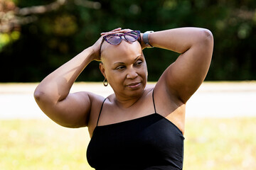 Bald Black woman outside