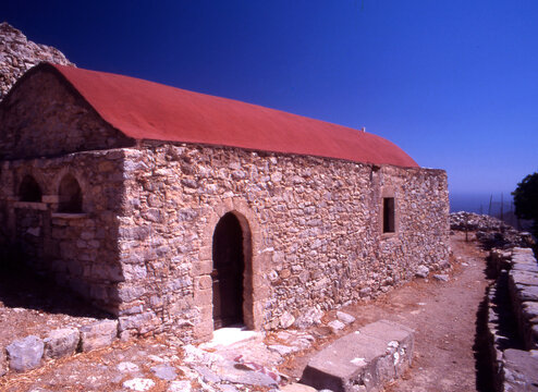 Outside the  17th C Church of Timia Zoni in the deserted village of Mikro Horio, Tilos, Greece