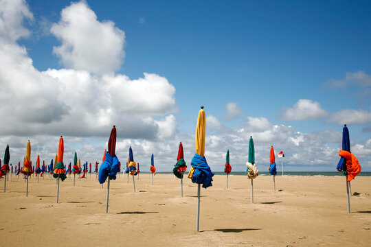 Colorful umbrellas on the beach in Deauville. Normandy, France.
