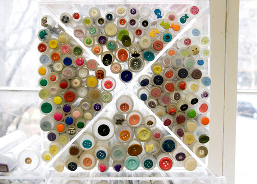 Buttons of various colors and sizes on display in a shop in Washington DC.