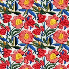 Fototapeta na wymiar Embroidery floral seamless pattern. Flowers repeating oriental fabric backdrop. 