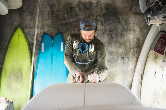 Surfboard Shaper measuring a new design