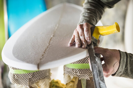 Surfboard Shaper refining a new design