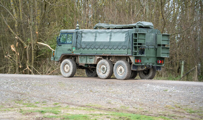 A British army Steyr-Daimler-Puch - BAE Systems Pinzgauer high-mobility 6x6 6WD all-terrain utility vehicle on a military battle exercise, Wilts UK