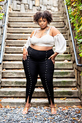 Plus size Black woman showing off fashion outside