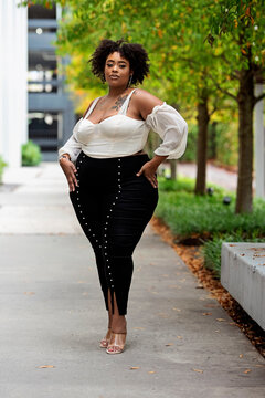 Plus size fashion forward Black woman outside 