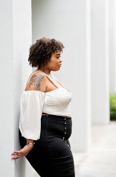 Plus size fashion forward Black woman outside 