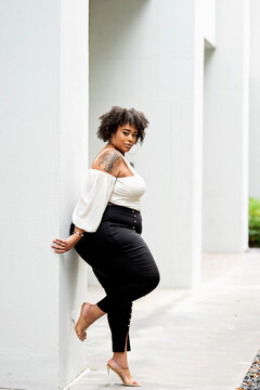 Plus size fashion forward Black woman outside 