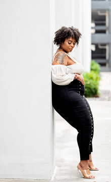 Plus size fashion forward Black woman outside 