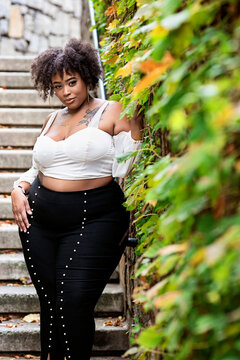 Plus size fashion forward Black woman outside 