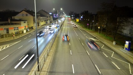 Cars move on the night highway. 