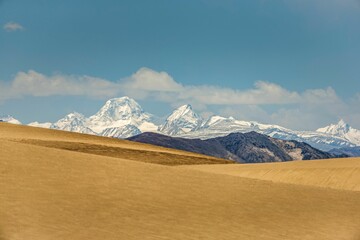 Dunes and Himalayas at the source of the Yarlung Zangbo River in Zhongba County, Xigaze, Tibet