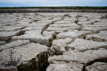closeup cracks in dry ground. Cracked surface