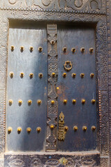 Traditional wooden carved door in Stone Town, Zanzibar, Tanzania