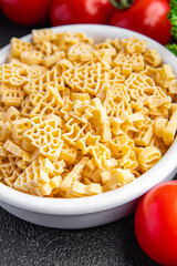 pasta christmas shape festive food spruce, star, santa, snowman delicious snack healthy meal food snack on the table copy space food background rustic top view