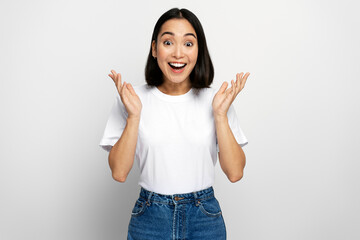 Happy surprised woman looking at camera with mouth open in amazement