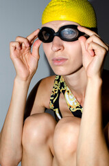 Portrait of young woman in swim hat	