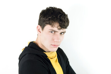 The young guy is still a teenager with a stern look, with a question in his eyes, the guy thinks...