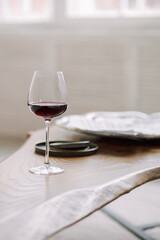 Glass of red wine on gray blurred background. High quality photo