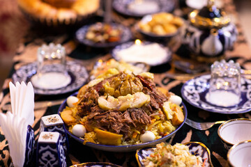 The royal dish Plov with beef, fat, garlic and quince.