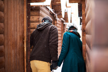 couple or friends holding by hands in center of town and looking for something or secluded meeting place