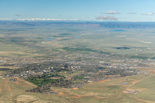 Aerial View of Laramie, Wyoming, USA with Snow Capped Mountains.