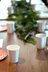 Striped shining recycled paper glasses on a party tableware