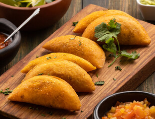 Colombian empanada with spicy sauce - Traditional food from Colombia
