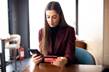 Business woman using credit card