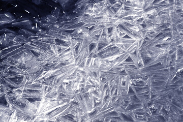 The texture of the ice surface. Winter background, festive background in the form of ice crystals.