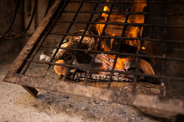 metal grill on wood set on fire