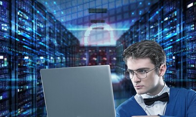 Futuristic data center and man holding laptop.