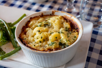 Seasoned Lentils and mushrooms pie slow cooked in red wine, topped with.cheddar mash and served with seasonal vegetables