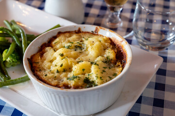 Seasoned Lentils and mushrooms pie slow cooked in red wine, topped with.cheddar mash and served with seasonal vegetables