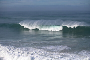 Magoito Beach during storm and high waves, beautiful sandy beach on Sintra coast, Lisbon district,...