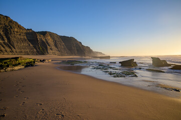Magoito Beach, beautiful sandy beach on Sintra coast, during low tide, Lisbon district, Portugal, part of Sintra-Cascais Natural Park with natural points of interest