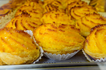 Baked sweet desserts cakes on display in balery in Lisbon, Portugal