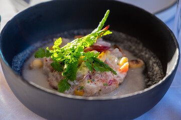 Tartare of seabass with mango, passion fruit and coconut milk