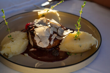 Beefsteak served with fresh black truffle mushroom and balls of mashed potato in French restaurant